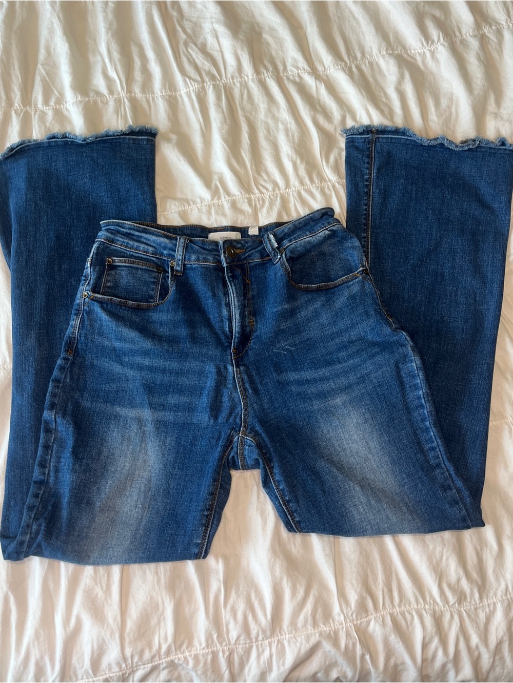 Blue Flare Jeans with Frayed Hem